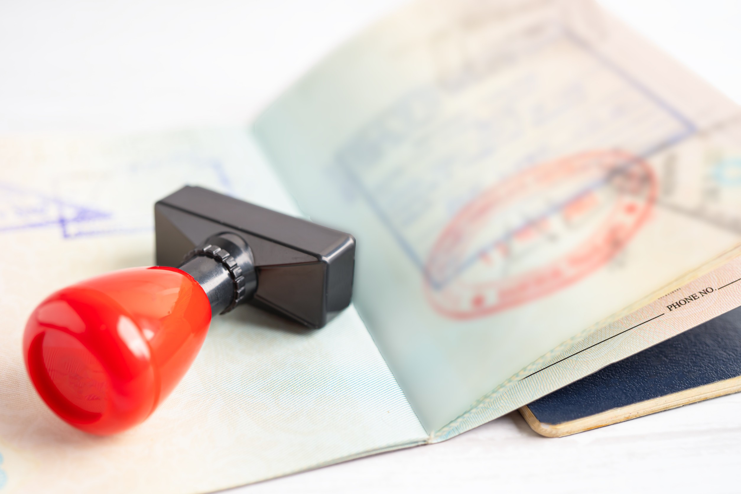 approved stamp visa and passport document to immigration at airport in country