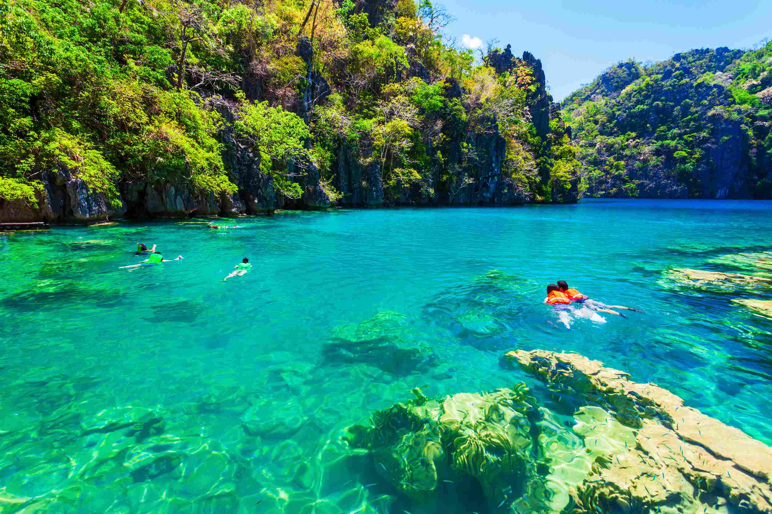 Tourists enjoy on Barracuda Lake in Coron Island, Philippines Tourists enjoy on Barracuda Lake in Coron Island, Philippines
