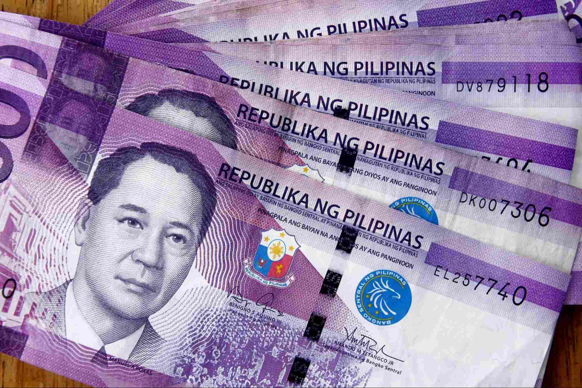 One hundred Philippine Peso bills One hundred Philippine Peso bills