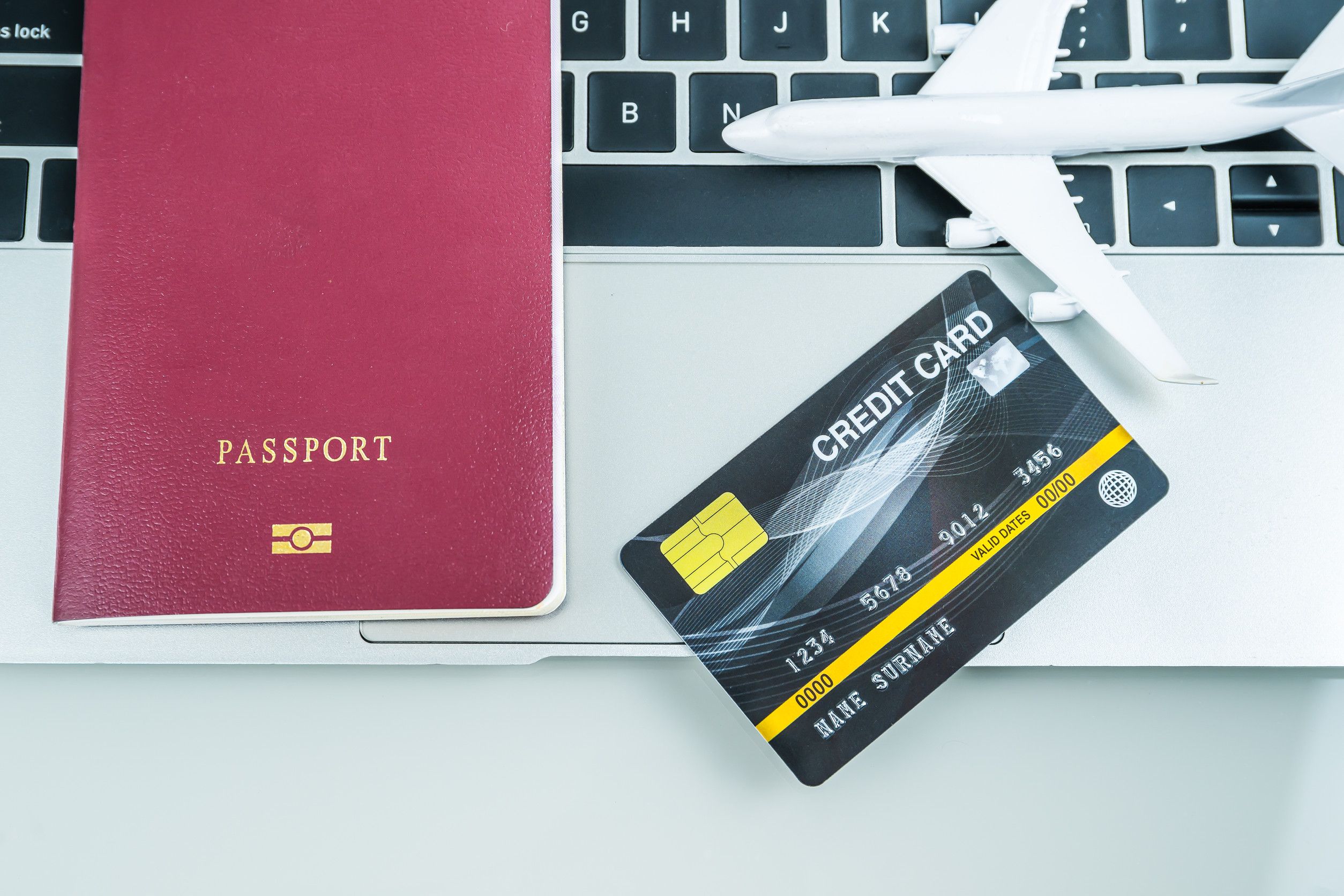 Passport, credit card, and airplane